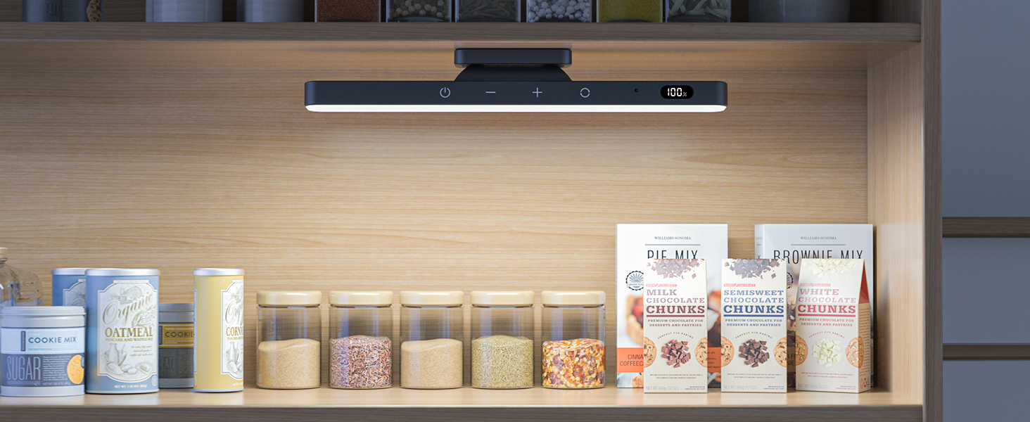 Under-cabinet lighting illuminating a kitchen shelf containing various glass storage jars and packaged goods with warm LED lighting.