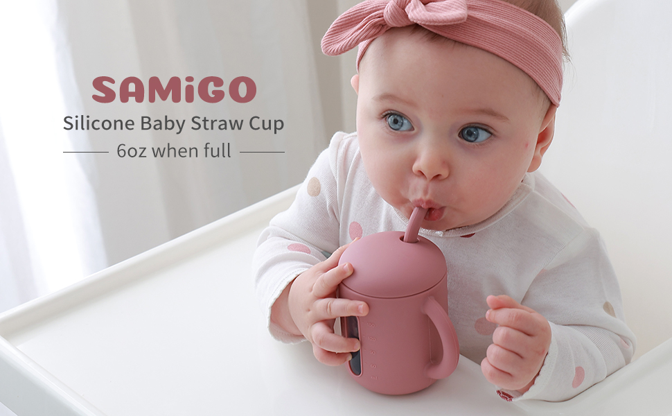 Samigo baby drinking out of a straw cup rose
