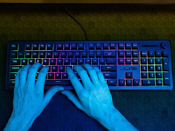 A close up view showing mans hands typing on the nightfall keyboard