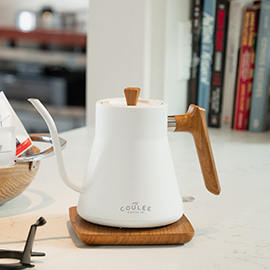 White Coulée Kettle on marble countertop