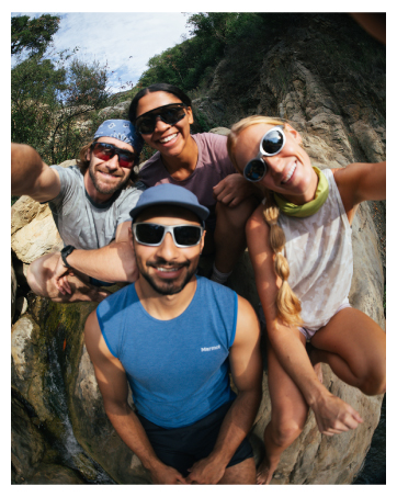 4 friends in Marmot gear smiling for fisheye lens photo