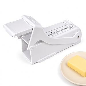 Close-up of butter slicer with markings, push-up button, and wire