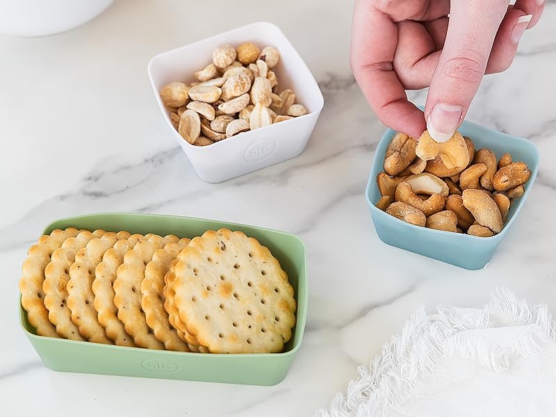 Silicone baking cups holding nuts and crackers