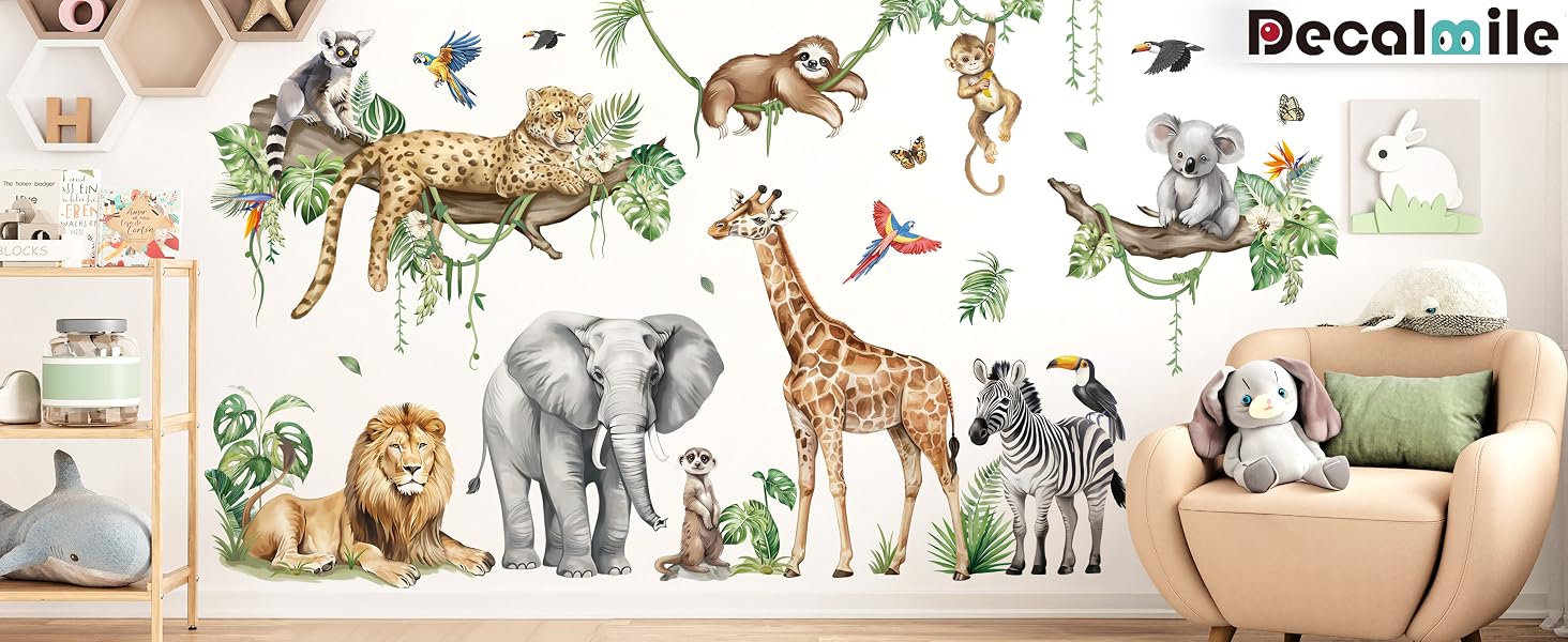 Colorful wall decals featuring various jungle animals including a giraffe, elephant, lion, zebras, and monkeys. Decorative elements include tropical leaves and butterflies. A chair with a stuffed animal is visible.