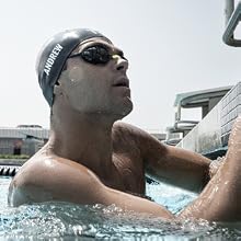 Image of person in water wearing water goggles with text reading watertight seal.