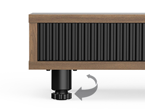 Rectangular wooden device with black vertical slats on front. Base features a circular component with an arrow indicating rotation capability.