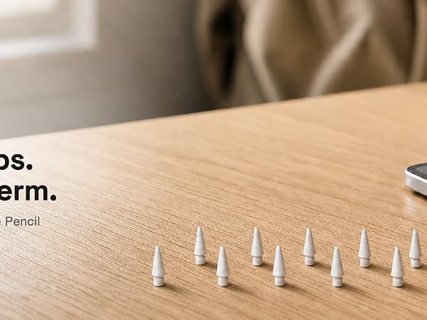 NXVX replacement tips arranged on a study desk beside a tablet