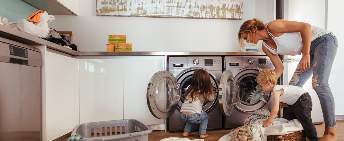mom and children helping with laundry