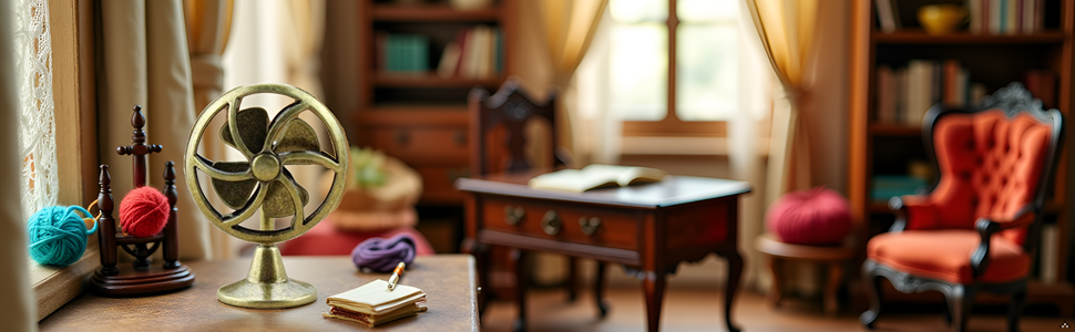 A vintage-style desk with a brass table fan and other antique office accessories.