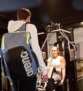 man using a gray arena Team 45 backpack at the gym great for swim practice and gym workouts