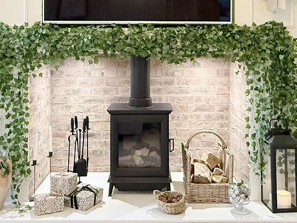 Interior space with exposed brick walls decorated with hanging plants, lanterns, and rustic design elements creating cozy atmosphere.