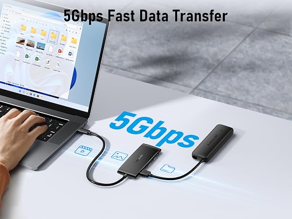 Text reads '56bps Fast Data Transfer'. Shows USB cable connection demonstrating data transfer between devices on a grey surface.