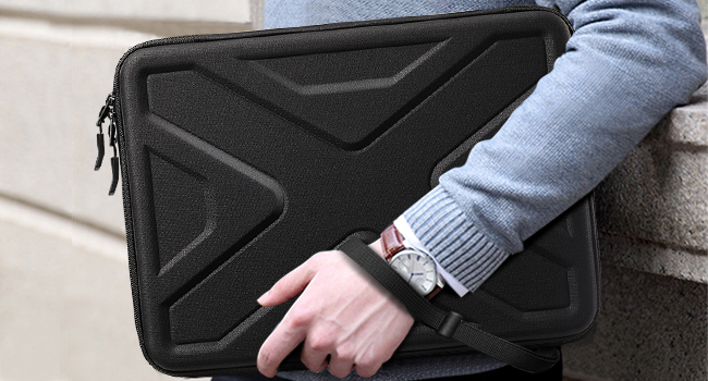the back of a person holding a laptop