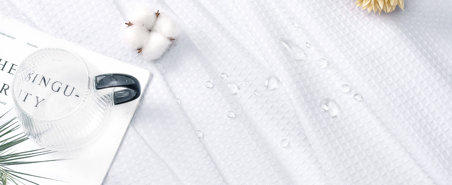 white fabric shower curtain