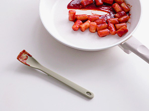 Mini silicone spatula with head-up design to keep sauce off the countertop