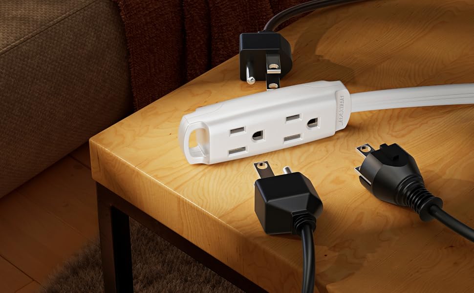 Black power strip and various plugs on a wooden table.