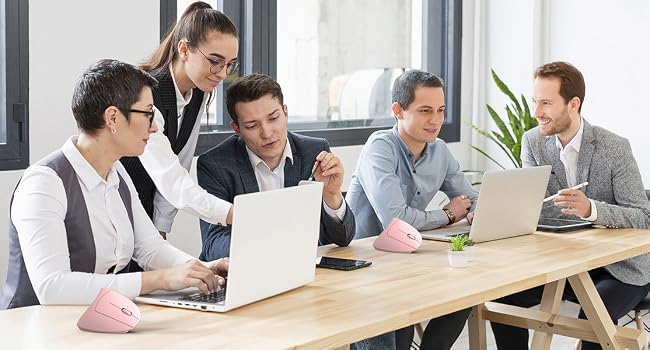 Text reads 'Image 1'. Office meeting scene showing people seated at wooden table with laptops, engaged in professional discussion.