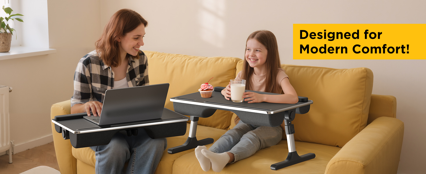 Mother and daughter using height-adjustable couch laptop desks for work and snacks.