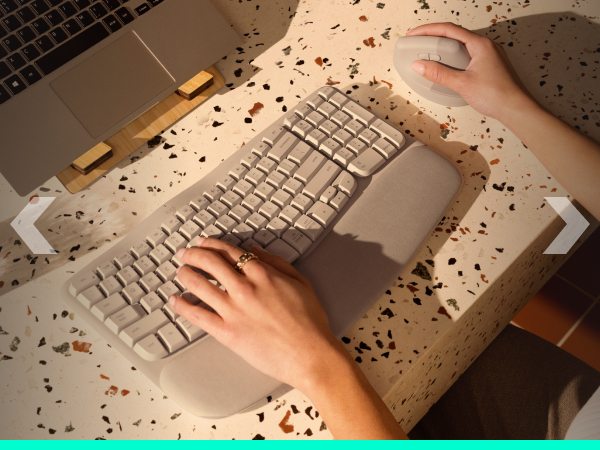 a woman using a keyboard and a mouse