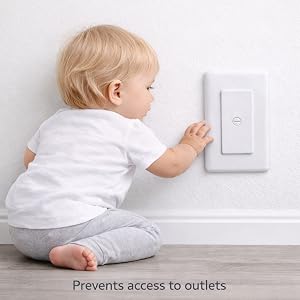 Child playing safe with outlet close