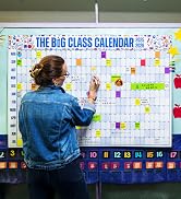 woman writing on calendar