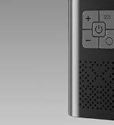 Close-up of electronic device control panel. Buttons visible include power, plus, minus, SOS. Side has perforated speaker grille.