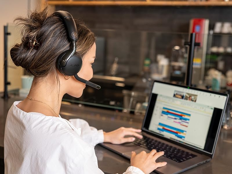 A woman taking a teams call with the go work 3 headset