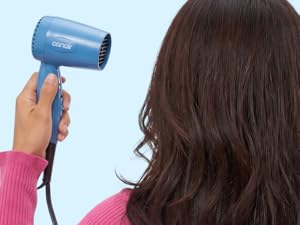 Woman with hair dryer