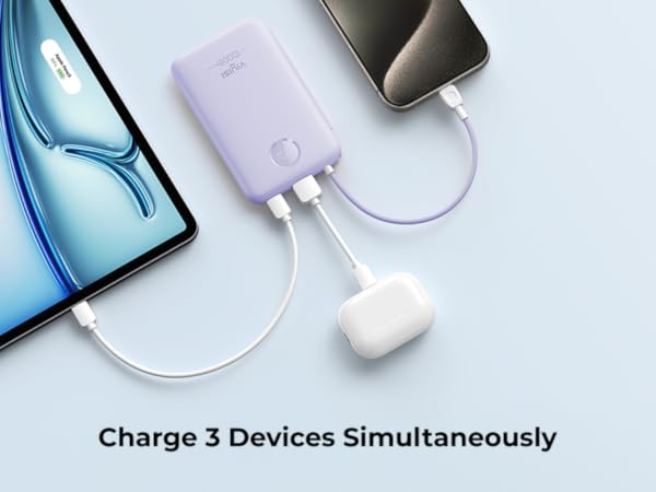 Portable power bank charging multiple devices simultaneously