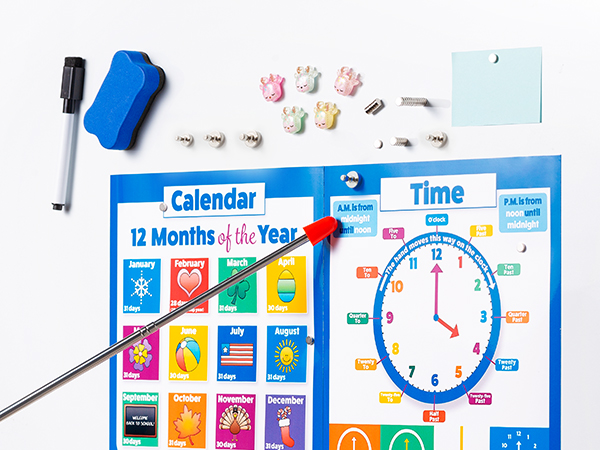 Educational time and calendar learning board featuring colorful monthly icons, clock face, and learning accessories including magnets and erasable marker.