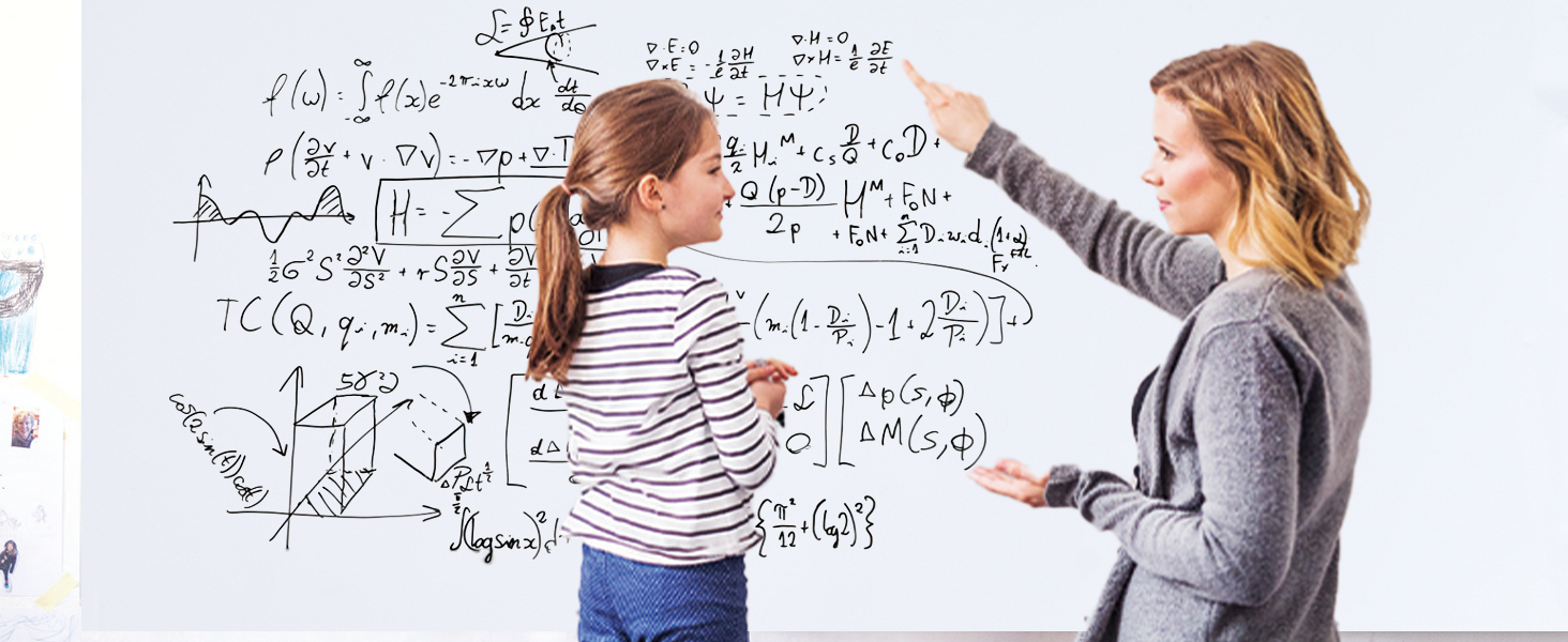A teacher is pointing to a formula on a whiteboard sticker to explain to a female student