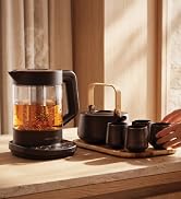 Vianté glass tea maker with tea cups and serving set by a sunlit window