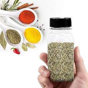 Hand holding Plastic Spice Jar