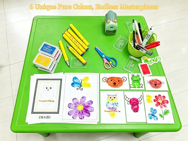 mother and child making fingerprint art together using washable stamp pad for kids