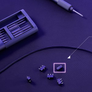 Zoomed in picture of a disassembled harpe ace mini with the micro switches on the desk