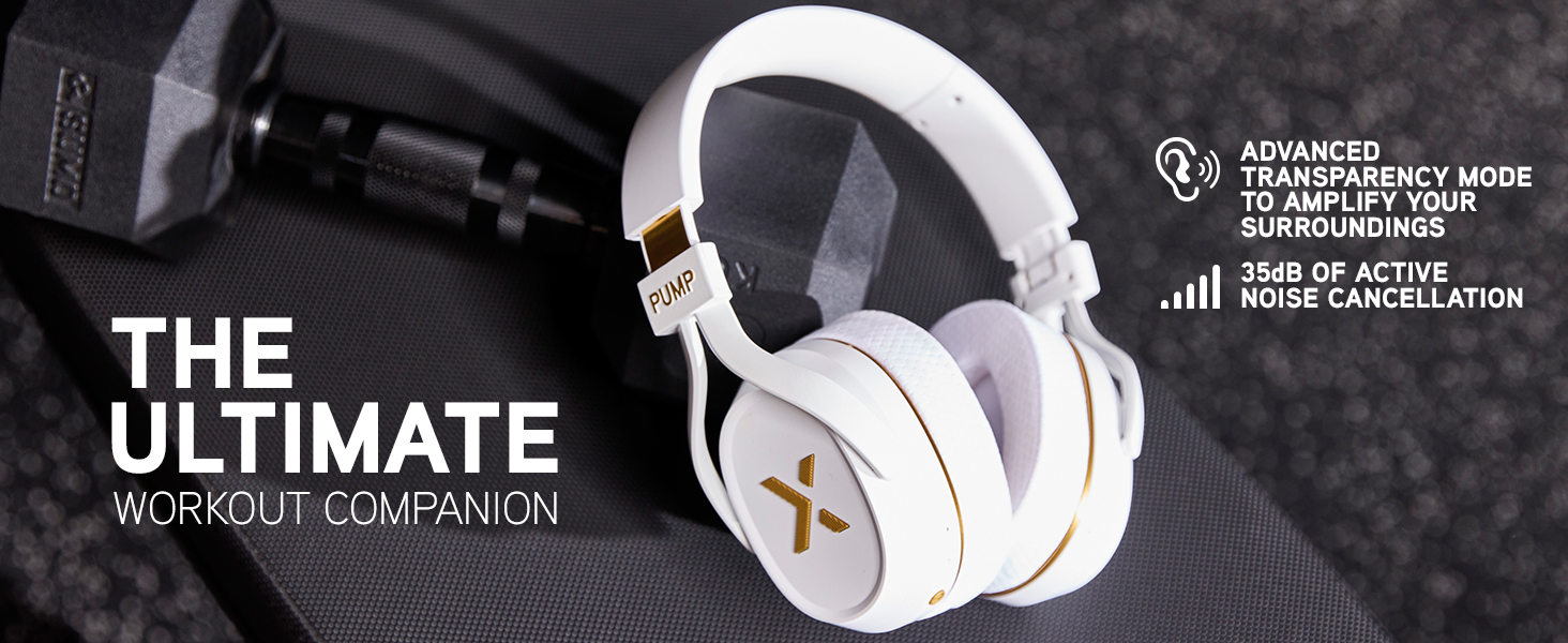 White Pump X headphones rest on a gym bench beside a dumbbell, symbolizing power, focus, and style
