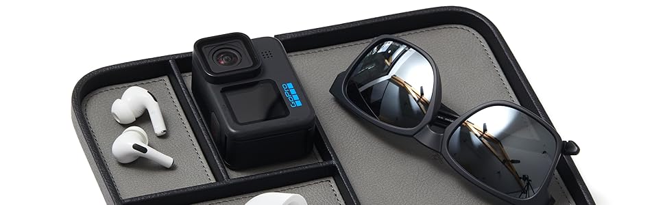airpods pro, go pro and sunglasses in valet tray