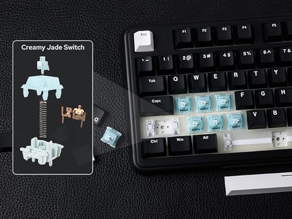 a black keyboard with a black keyboard and a black keyboard with a green and white design.