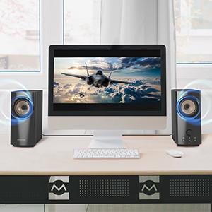person using T60 on desktop with immersive desktop audio made possible by creative t60 speakers