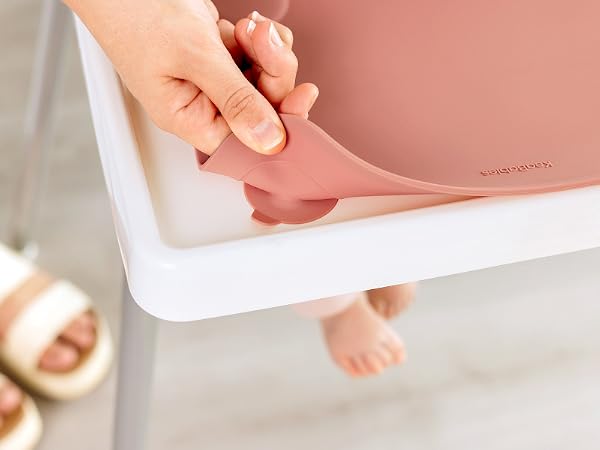 Prep silicone placemat showing flexible design and secure grip while attached to high chair tray