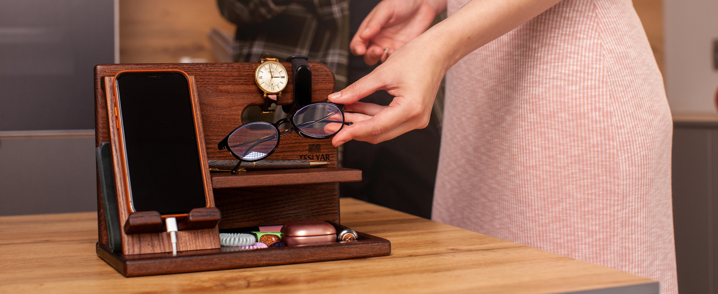 Wooden desk organizer with phone stand, watch display, and storage compartments for glasses and accessories.