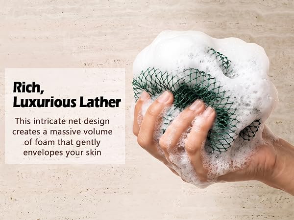 This intricate net design creates a massive volume of foam that gently envelopes your skin