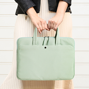 woman holding a green bag