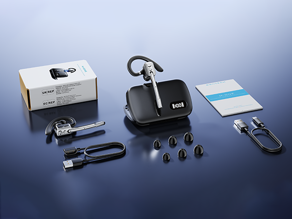 Flat lay arrangement of multiple black electronic accessories and gadgets including cable management device, charging cables, adapters, and small tools on blue background.