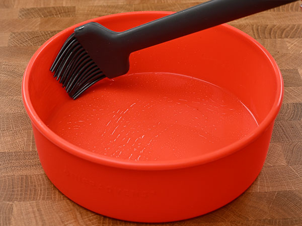 sweeping oil along the walls of the air fryer cake pan