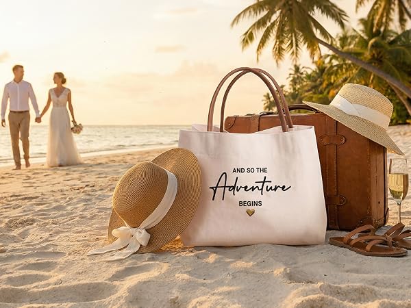 A couple walking on a tropical beach next to a honeymoon gift tote bag and vacation essentials.