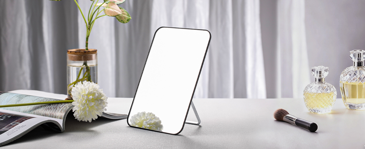 Series of makeup application scenes showing cosmetic products, brushes, and beauty tools arranged on a reflective surface with dramatic lighting.