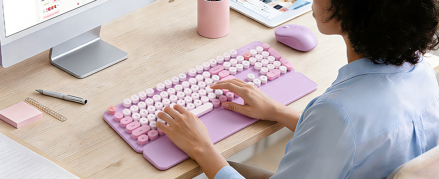 Office worker typing on a lavender retro round-keycap keyboard with wrist rest