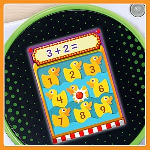 Close up of a math learning screen with numbered ducks. 3+2=