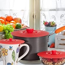 Red silicone lids on cup pot and bowl